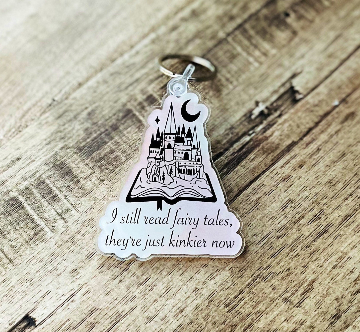 I still read fairy tales, they’re just kinkier now keychain