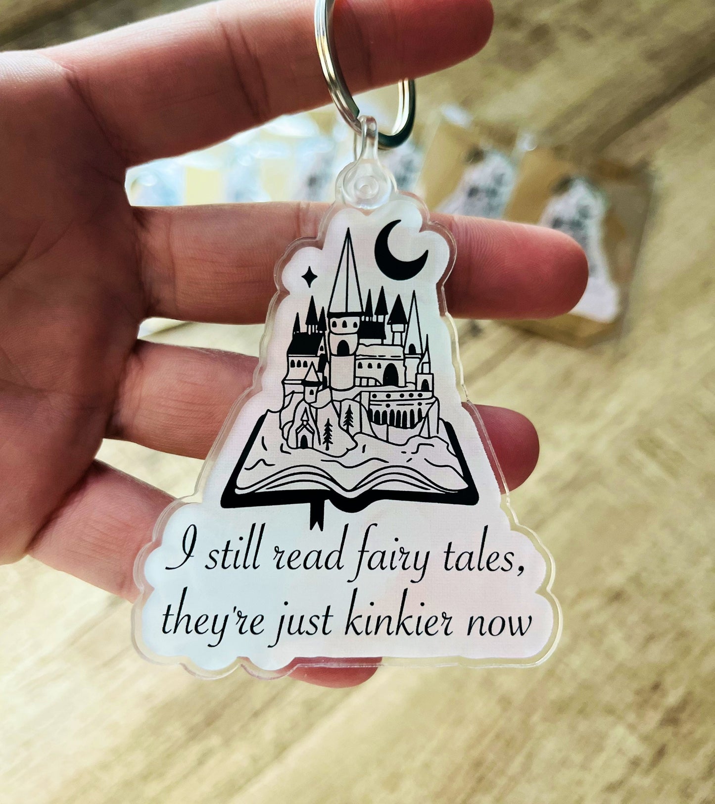 I still read fairy tales, they’re just kinkier now keychain