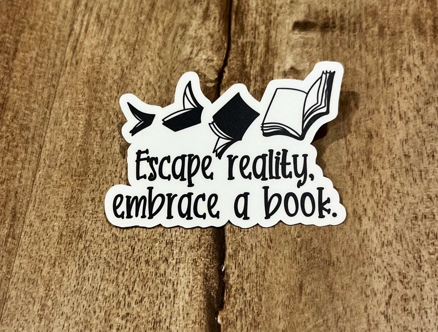 Escape reality, embrace a book. Waterproof sticker